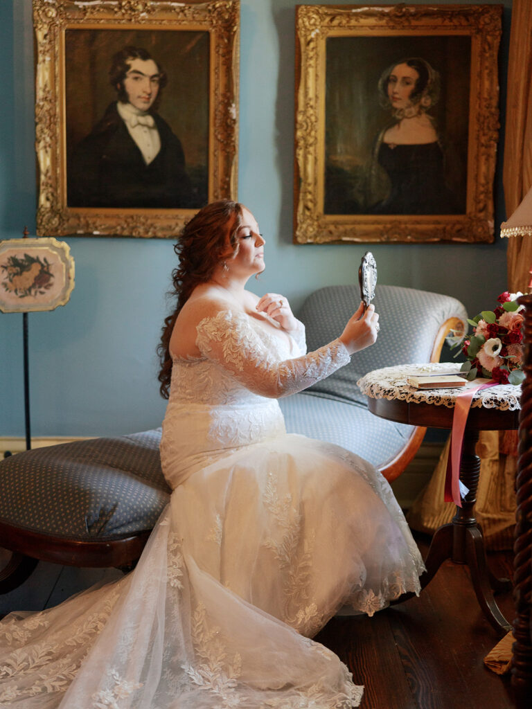 Taylor-Grady House Wedding getting ready with bride looking in mirror