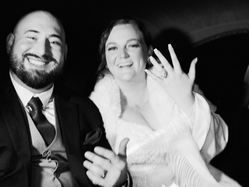 Taylor-Grady House Wedding with bride and groom in the back of the car showing their rings