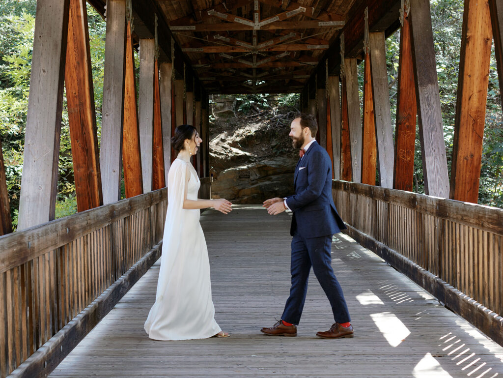 Couple during their first look at their Roswell Mill wedding