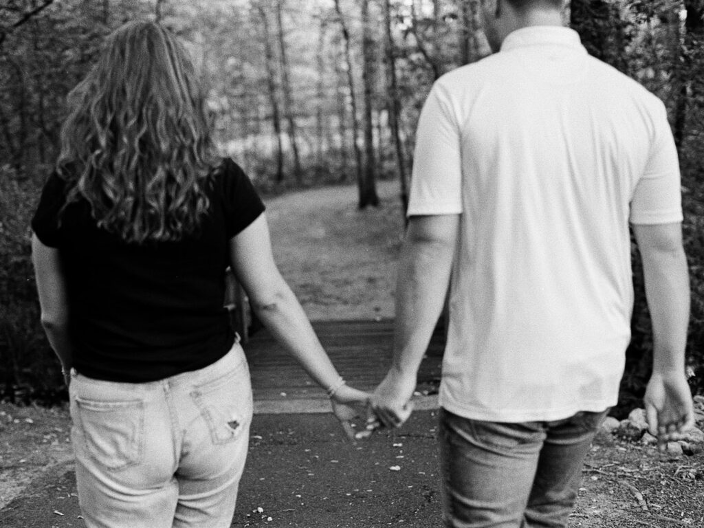 Couple holding hands on film photography